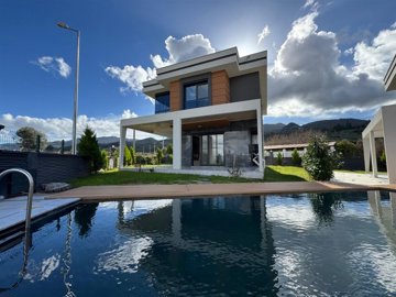 Detached Kusadasi Property For Sale With Nature Views - A modern villa with a large private pool