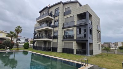 Primely Located Apartment In Belek, Antalya For Sale - A modern complex with a communal pool