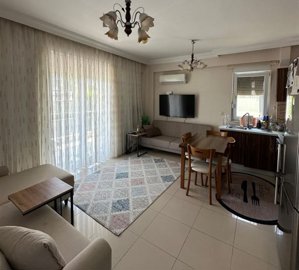 Delightful Apartment In Antalya For Sale - Lounge seating area with balcony access