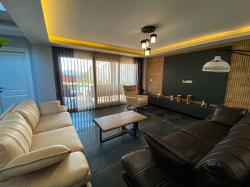 Incredible Fethiye Villa For Sale - Lounge with pool and garden access