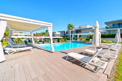 Ready-To-Move Property For Sale In Manavgat, Antalya - Sun lounging terraces around the pool
