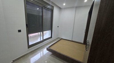 Tasteful Belek Apartment In Antalya For Sale - Bedroom with a balcony