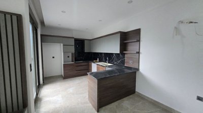 Tasteful Belek Apartment In Antalya For Sale - From the lounge to the kitchen