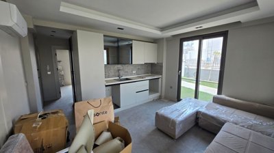 Divine Ground-Floor Apartment In Belek, Antalya For Sale - Open-plan living space and kitchen