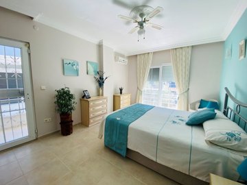 Sizeable Semi-Detached Villa For Sale In Didim – Bedroom with a balcony
