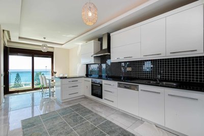 Immaculate Alanya Apartment In Kestel For Sale - Fully fitted kitchen with balcony access