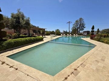 Furnished Sea-View Apartment For Sale In Bodrum – Large communal pool and sunbathing terraces