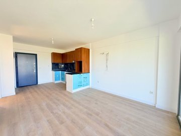 A Brand New Sunset View Apartment For Sale In Milas, Dorttepe - Modern corner kitchen