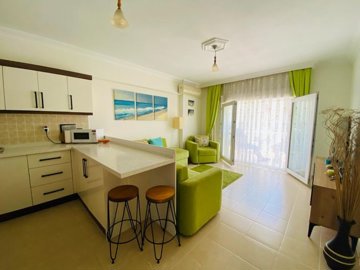 Immaculate Apartment For Sale In Altinkum – Partial sea view balcony from the lounge