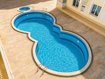 Great Value Apartment For Sale In Altinkum – Communal swimming pool and sunbathing terraces