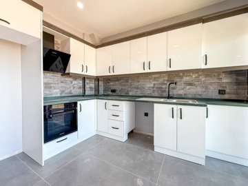 Incredible Belek Apartment In Antalya For Sale - Modern kitchen with several white goods