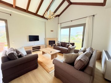 Flawless Property For Sale In Yalikavak - Lounge with a fireplace