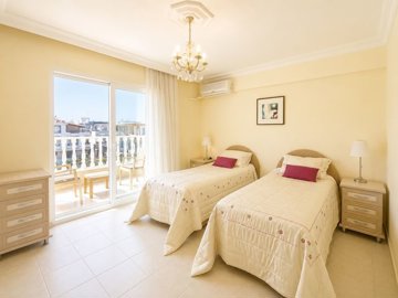 Sea View Apartment For Sale In Didim Near Altinkum – First bedroom with an ensuite and balcony