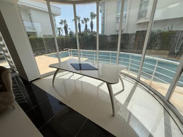 Spotless Villa For Sale In Belek, Antalya With A Private Garden & Pool - Views to the pool from the lounge