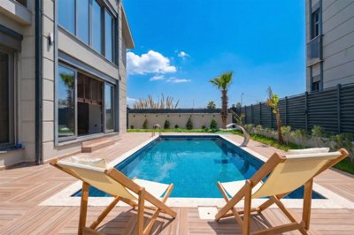 Striking Villa For Sale In Belek, Antalya With A Private Pool - sun terraces around the pool