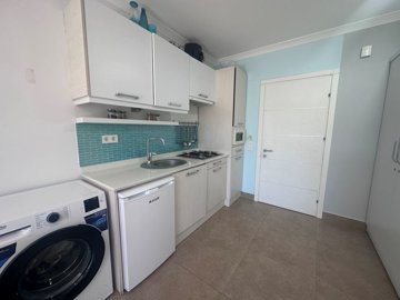 Beautiful Key Ready Apartment For Sale In Dalyan - Kitchen with white goods and appliances