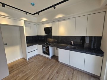 Tasteful Newly-Built Antalya Property for Sale Near The Beach - Sleek kitchen with built-in white goods