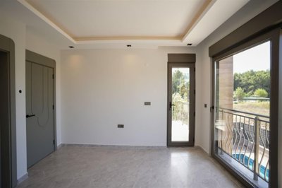 Breathtaking Belek Villa For Sale In Antalya - Bedroom with a balcony