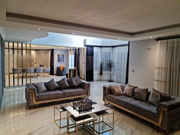 Masterpiece Villa With A Private Pool, Sauna & Garden For Sale in Belek - Lounge to the formal dining area