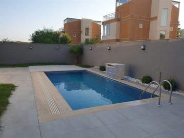 Idyllic Antalya Villa For Sale In Belek - Large sunbathing terrace around the pool
