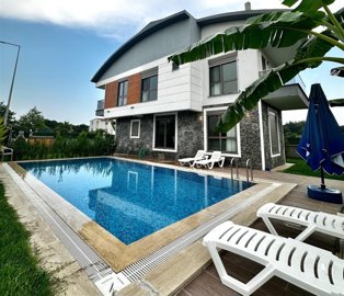 Impeccable Villa With Private Facilities For Sale In Belek - Main view of the villa and swimming pool