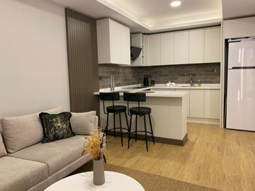 Refurbished Antalya Apartment Near Lara Beach For Sale - Modern open-plan living room