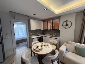 Divine Apartment For Sale With On-Site Luxury Facilities - Modern corner kitchen with white goods