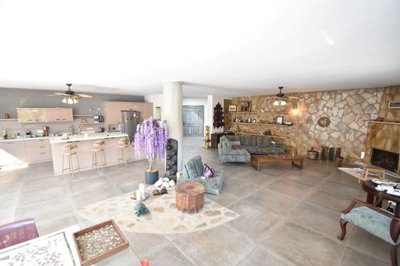 Luxury Bespoke Bungalow For Sale In Uzumlu - Huge open-plan living area with a fireplace