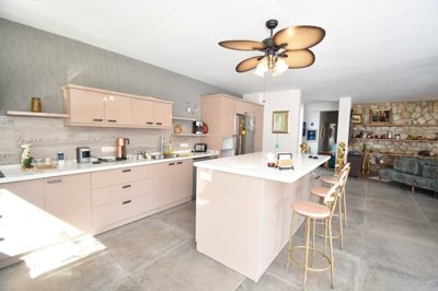 Luxury Bespoke Bungalow For Sale In Uzumlu - Modern fully fitted kitchen with an island