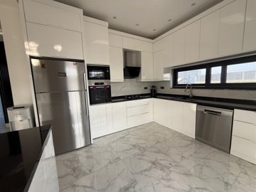 Blissful 4-Bedroom Villa For Sale In Belek With A Private Exterior & Pool - Large fully fitted kitchen with a breakfast bar