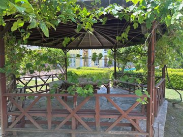Scenic Apartment For Sale In Picturesque Dalyan - Pergola in the landscaped gardens