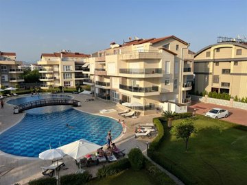 Furnished Apartment In Belek For Sale - Communal swimming pool and social sunbathing terraces