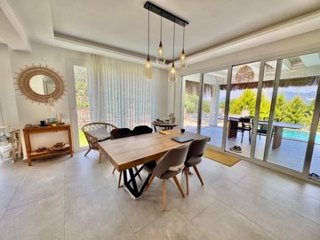 Upscale Detached Villa In Fethiye For Sale - Dining area with pool access