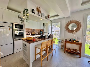 Upscale Detached Villa In Fethiye For Sale - Kitchen with a breakfast island