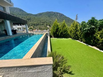 Upscale Detached Villa In Fethiye For Sale - Private infinity pool and manicured garden