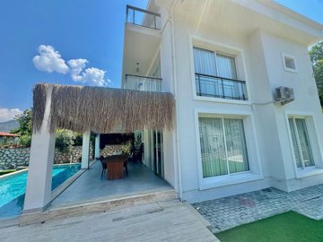 Upscale Detached Villa In Fethiye For Sale - Beautiful covered terrace poolside