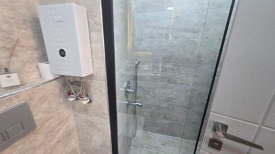 Key-Ready 1-Bedroom Apartment For Sale In Antalya - Shower cabin and electric water heater
