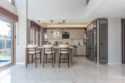 Smart Home Villa For Sale In Belek With A Private Garden & Pool - From the lounge to the kitchen