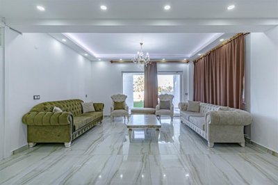 Striking Villa With Private Spa Facilities For Sale in Belek - Lounge with garden access