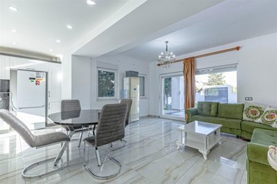Striking Villa With Private Spa Facilities For Sale in Belek - Kitchen with a seating area