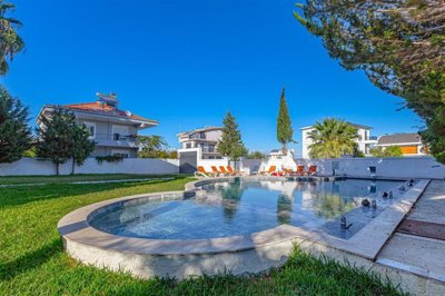 Striking Villa With Private Spa Facilities For Sale in Belek - Landscaped outdoor space and pool