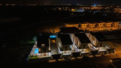Smart Home Villa For Sale Near Golf Courses & The Airport In Belek - Night time view over the villa