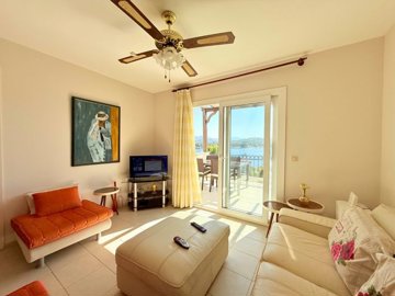 Sea-View Bodrum Property For Sale In Bitez - Lounge with balcony and sea views