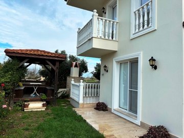 Garden-Floor Apartment For Sale In Scenic Dalyan - Garden with a pergola seating area