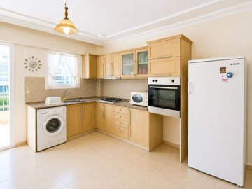Attractive Didim Apartment For Sale – Modern kitchen with white goods