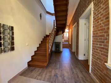 Inspiring Stone House For Sale In Ayvalik - Entrance hallway with a wooden staircase