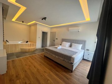 Detached Spa Villa For Sale in Belek, Antalya With Private Facilities - Master bedroom with a jacuzzi