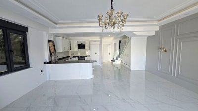 Immaculate Villa For Sale in Antalya, Belek With A Private Pool - Spacious living room with an American kitchen