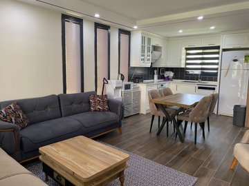 Sea View Villa For Sale In Kusadasi - Lounge, dining space and kitchen
