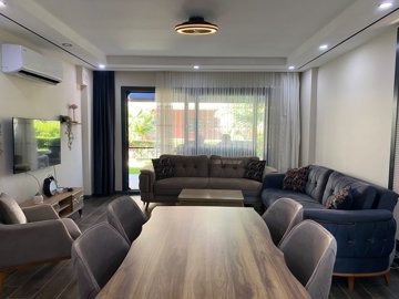 Sea View Villa For Sale In Kusadasi - Lounge with veranda access